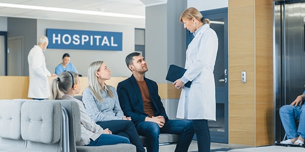 Hospital ER waiting room improves waiting time making a young couple happy.