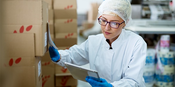 Laboratory supervisor performing manual inventory without a lab inventory management system